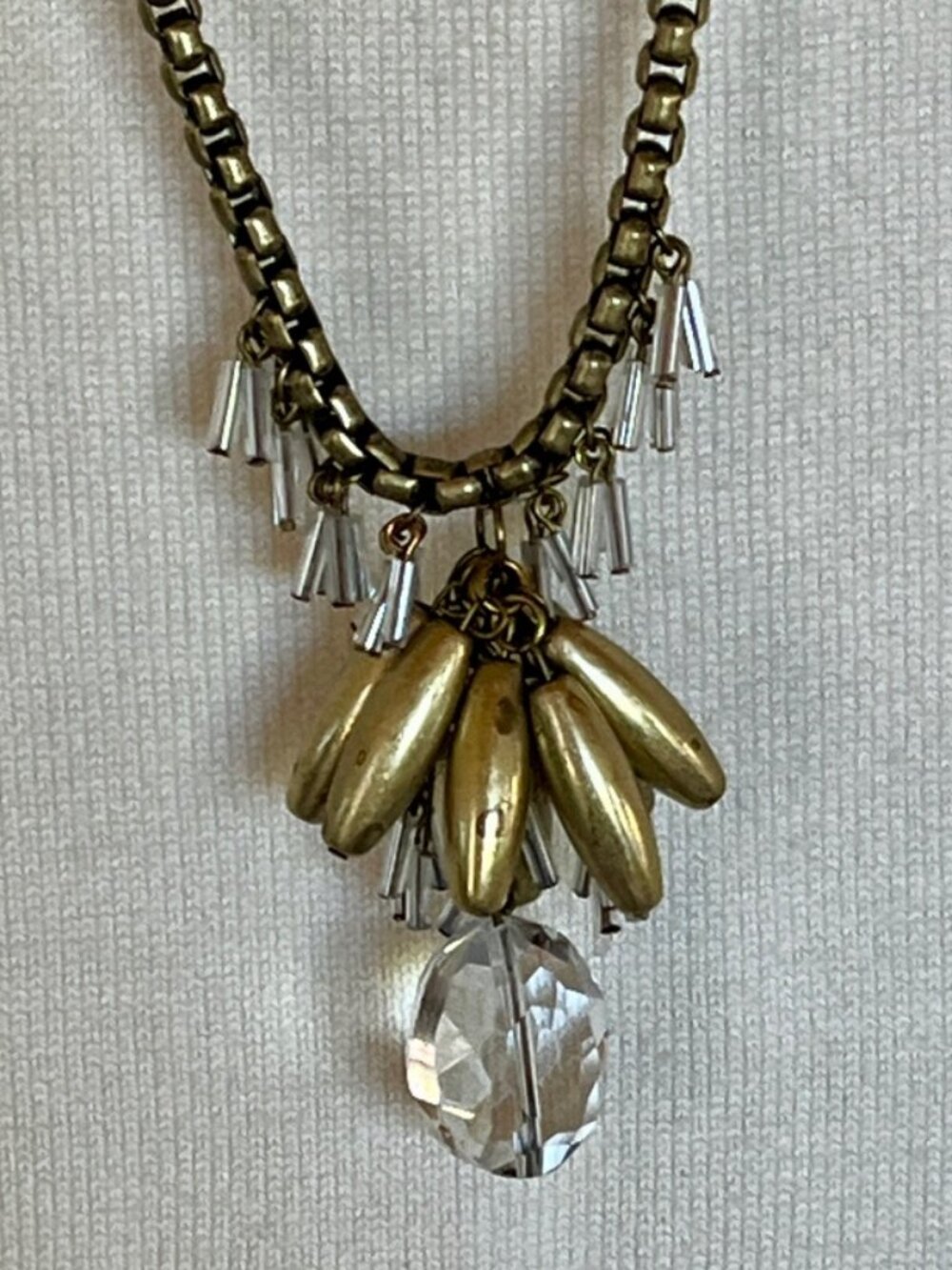 Antiqued gold pendant necklace with assorted beads